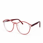 A pair of round, transparent clear acetate eyeglasses featuring vibrant red rim accents and deep maroon temples, displayed on a plain white background.