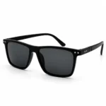 Sunglass EV2K-0039 Sleek Rectangle Sunglasses in Glossy Black, glossy black frame with dark grey tinted lenses, twin silver rivet studs at each outer corner and ribbed temple detailing with a double-dot rivet