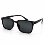 Sunglass EV2K-0048 Modern Square Sunglasses in Matte Black with grey tinted lenses, slim top bridge and small silver bar accents at the front corners